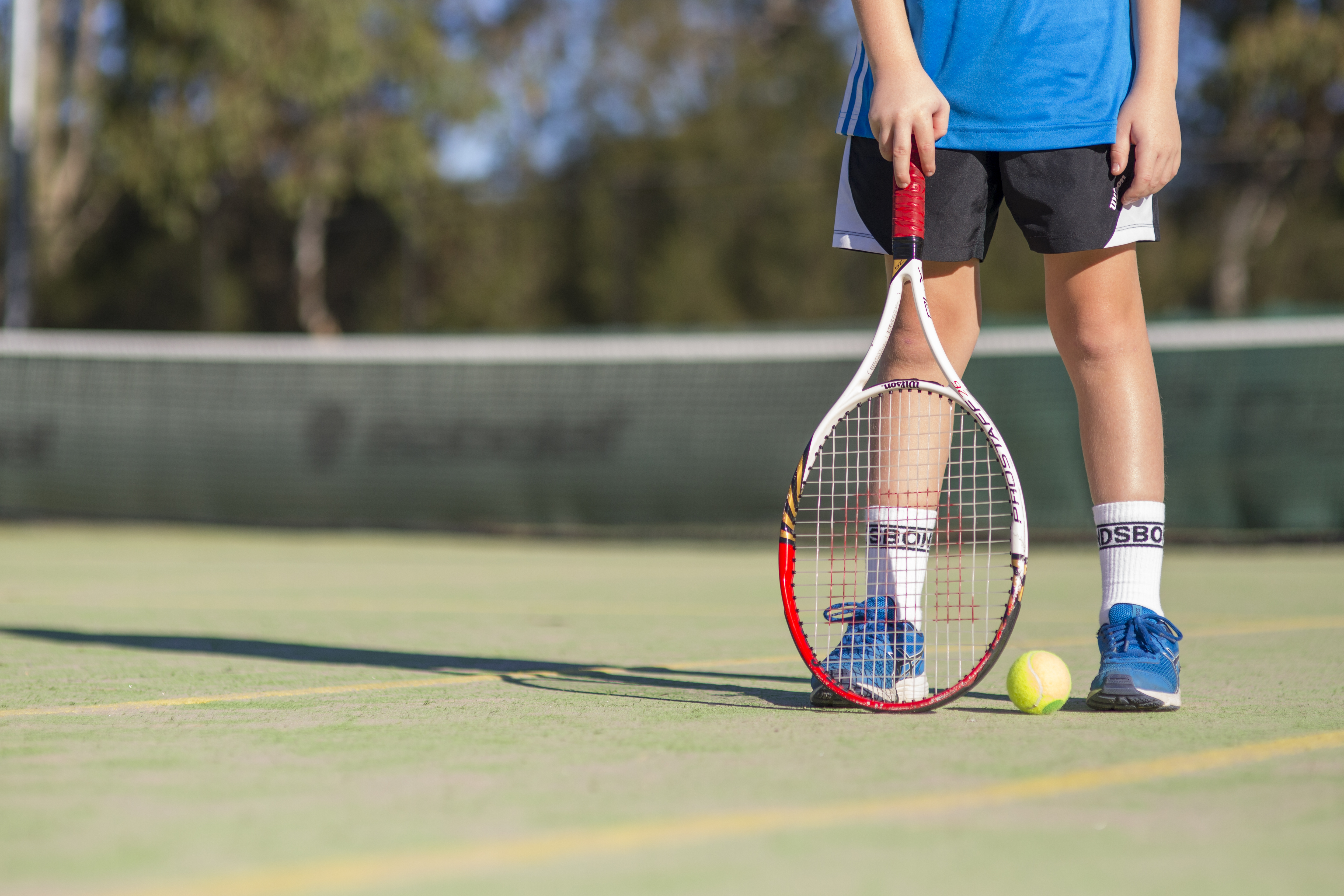 Boy playing tennis