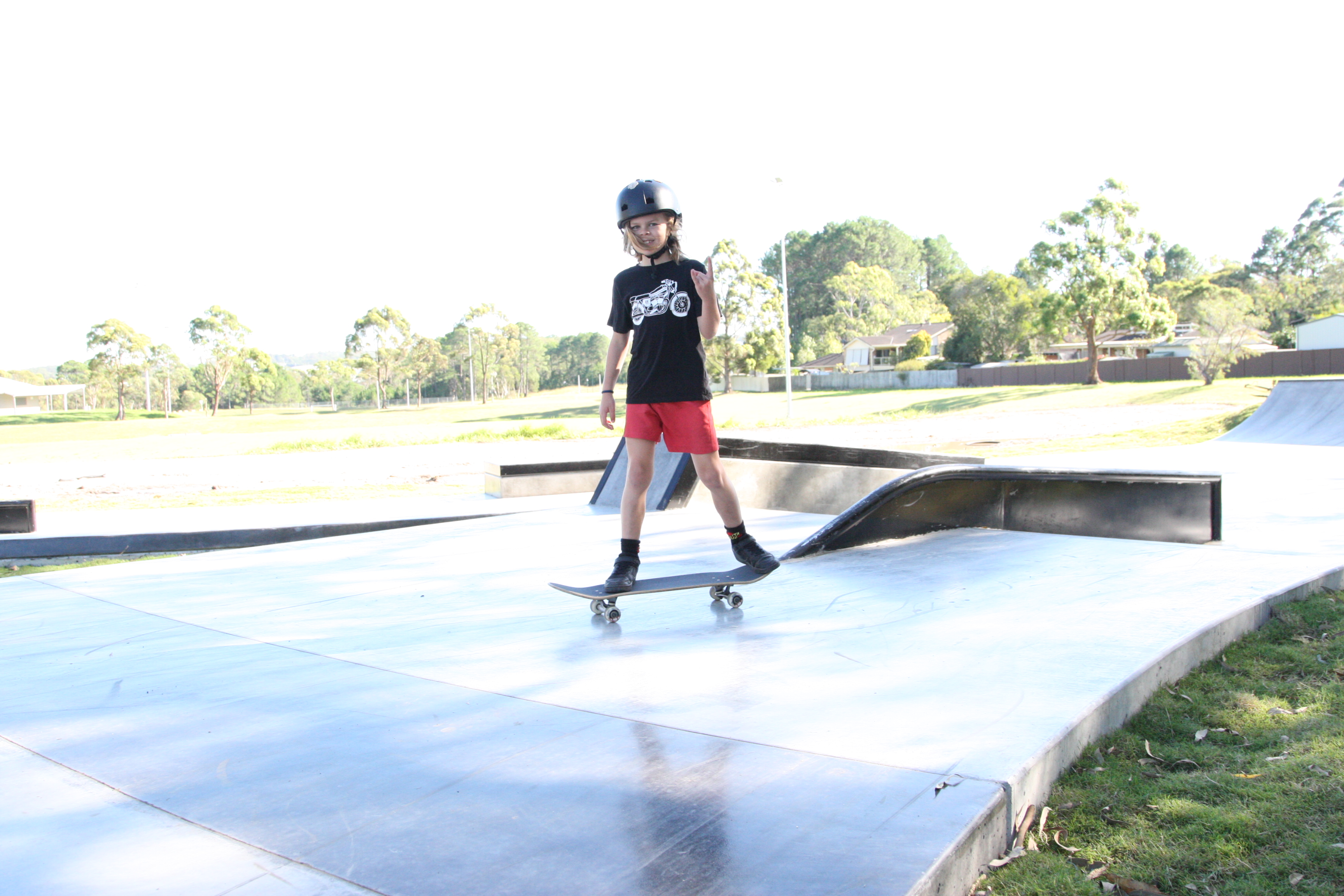 Kariong skate park with boy skateboarding 