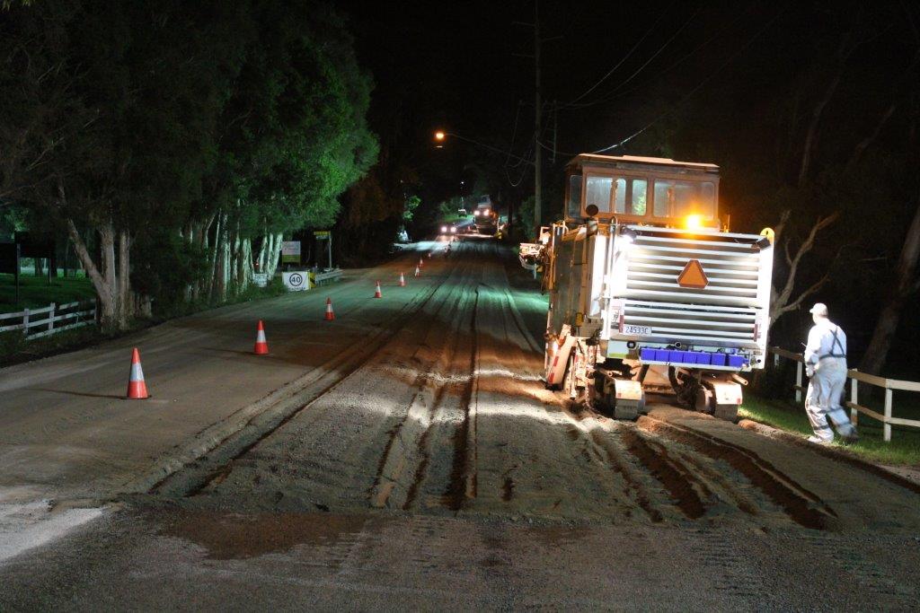 Night road works with heavy machinery