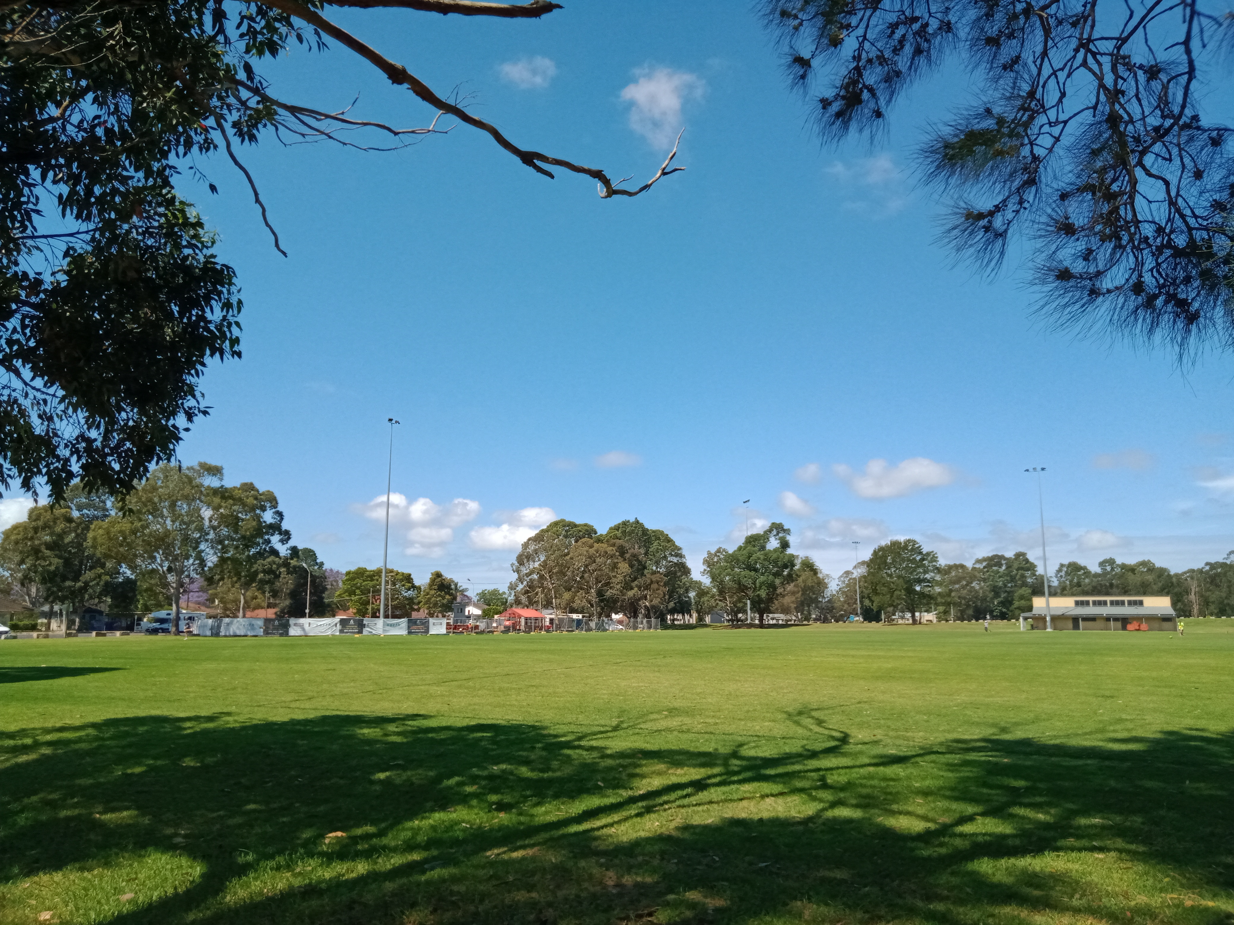 sports oval with construction site in background at Woy Woy Rogers Park