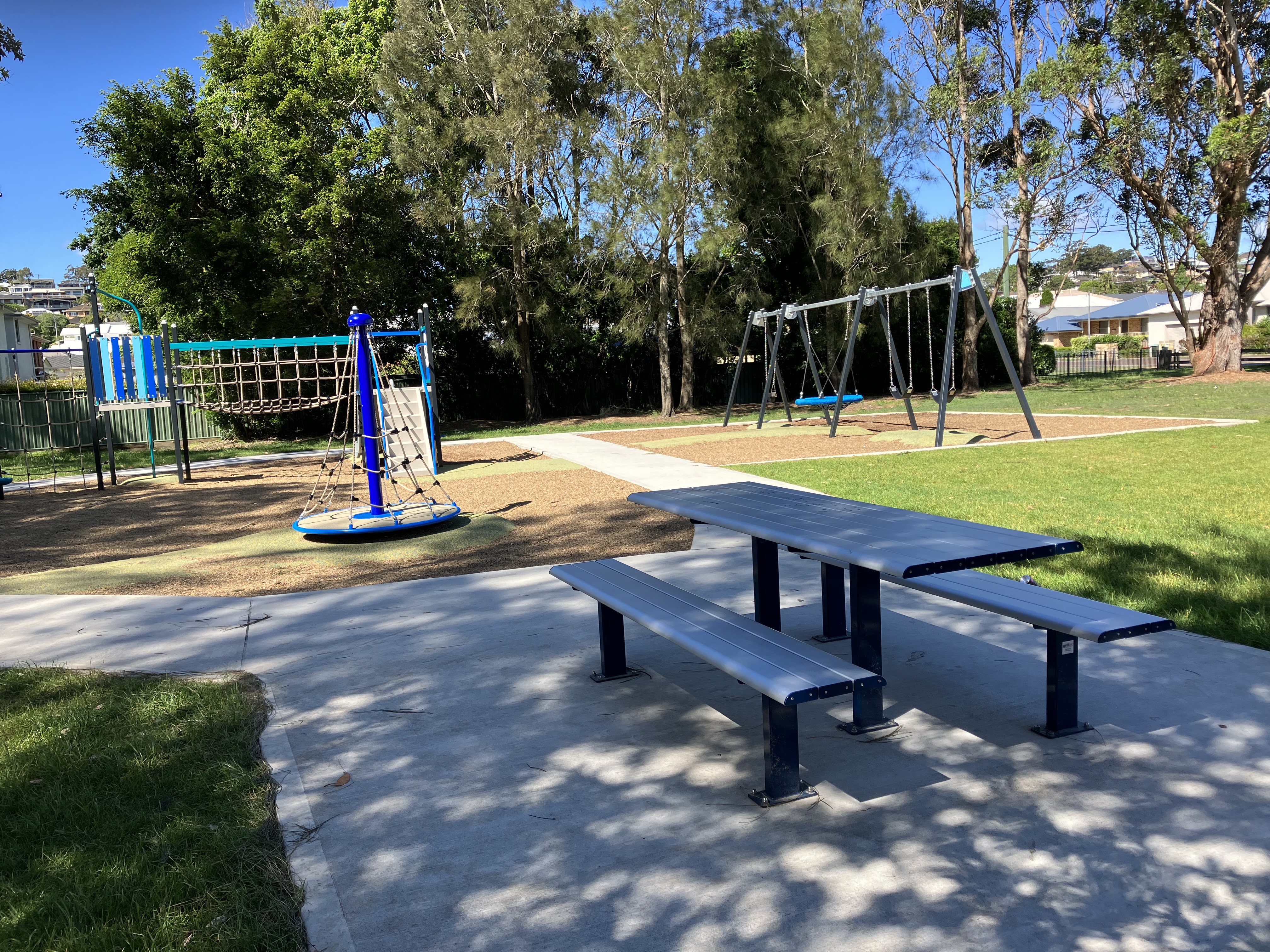 picnic table in shade at playspace