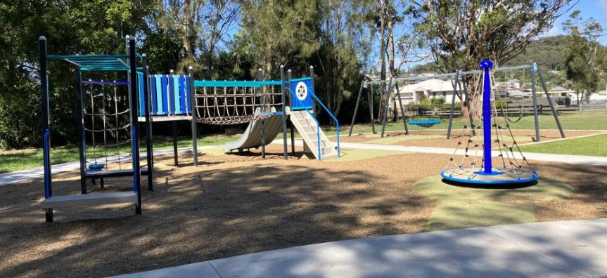 play equipment in a park with pathway 
